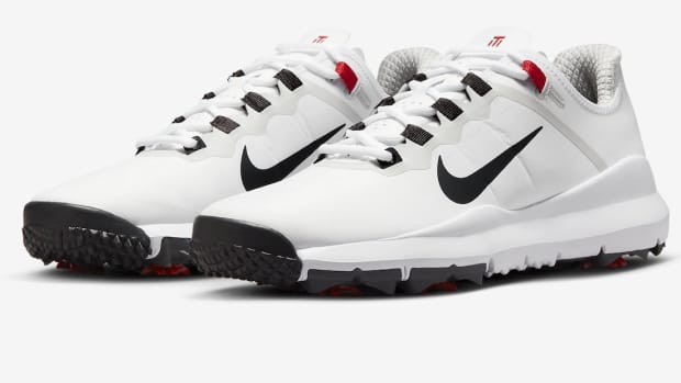 View of white and black Nike golf shoes.